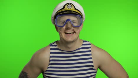 Emotional-man-tourist-in-underwater-mask-waving-hands,-striped-sailor-shirt