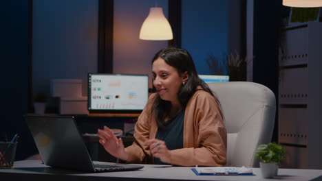 Happy-cheerful-businesswoman-smiling-while-looking-at-laptop-computer
