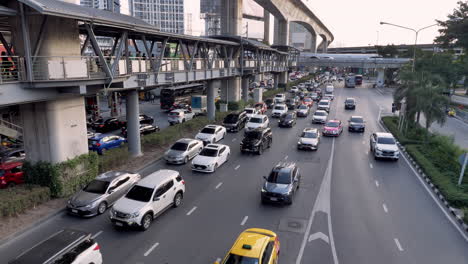 Slow-moving-traffic-in-one-of-the-major-thoroughfares-in-the-middle-of-the-city-of-Bangkok,-Thailand