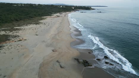 aerial-established-drone-of-sand-dunes-tropical-beach-in-Puerto-escondido-Mexico-Oaxaca