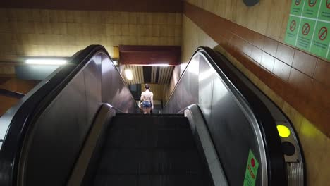A-Girl-Descending-Tube-Staircase-in-Underground,-Subway-Station-in-Buenos-Aires-City-Argentina