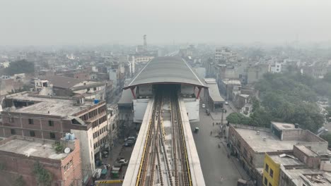 -Aerial-drone-above-main-train-station-public-transport-of-Lahore,-Pakistan