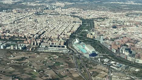 Aerial-view-of-Valencia-city-center-and-the-City-of-Science,-shot-from-a-jet-cockpit-arriving-to-the-airport