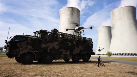 Military-drone-take-off-with-attached-grenade-near-Nuclear-power-plant