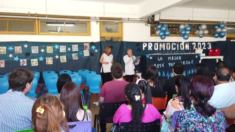 Families-Gather-at-Children-Public-School,-Teacher-Speaks-in-Graduation-Ceremony-at-Buenos-Aires,-Argentina