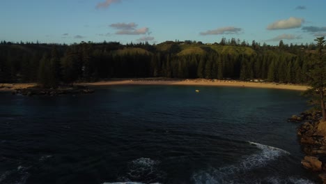 Picturesque-Emily-Bay-on-Norfolk-Island-with-the-lone-Pine-tree-and-forest