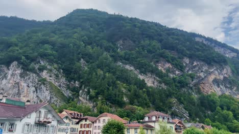 Interlaken-Switzerland-Immersive-Travel-Tourism-Mountainside-Valley-Resort-City,-Europe,-Walking,-Rainy-Day,-4K-|-Looking-Around,-Shaky,-Water,-River,-Lake,-Restaurant,-House,-Village,-Hill,-Cafe