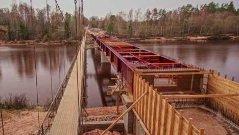 Time-lapse-of-a-bridge-construction-at-a-river-during-changing-seasons