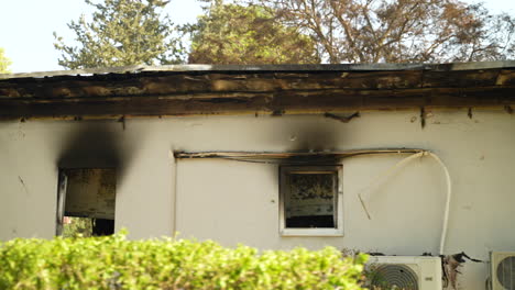 Home-in-Kibbutz-Be'eri-was-attacked-on-October-7th,-remnants-of-the-house-are-burned,-windows-are-scorched