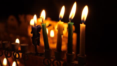 Forth-night-of-Hanukka-marked-by-the-four-lit-candles-and-shamash-in-the-menorah