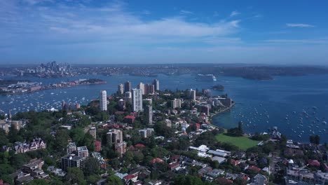 Aerial-pan-view-of-Sydney-Skyline-from-Eastern-Suburbs-featuring-Harbour-Bridge-Opera-House,-Darling-Point-and-Rushcutters-Bay