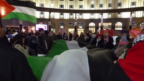 Palestinian-community-waving-country-flag-in-the-city-center-of-Brussels-in-the-evening