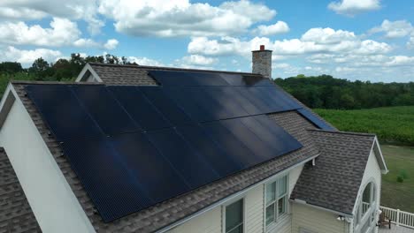 Solar-panels-on-house-with-shingle-roof-on-bright-sunny-day