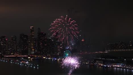 Chicago-buildings-at-night-with-fireworks-aerial