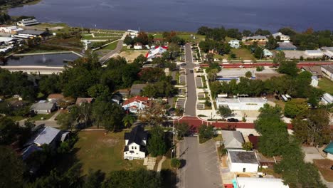High-angle-aerial-overview-pans-across-historic-red-brick-road-of-downtown-Clermont