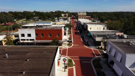 Drone-trucking-pan-from-left-to-right-above-historic-Downtown-Clermont-Florida-at-midday