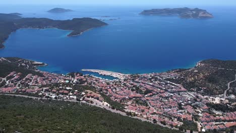 Aerial-pan-across-seaside-town-of-Kas-on-Mediterranean-coast,-Turkey