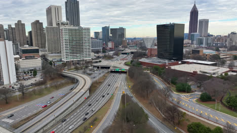 Aerial-establishing-shot-of-skyline-with-modern-buildings-and-traffic-on-main-road-in-Atlanta-City
