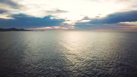 Still-drone-shot-of-sunrise-over-the-Sea-of-Cortes-in-Los-Cabos-Mexico
