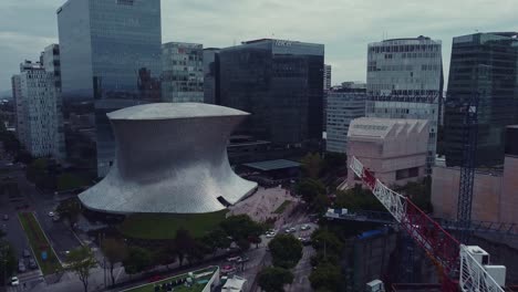 Track-drone-shot-over-Polanco-where-the-Soumaya-Museum-is-surrounding-of-corporate-buildings