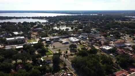 Panoramic-aerial-parallax-around-historic-downtown-Clermont-Florida-at-midday