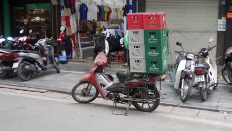 Unmanned-motorbike-parked-on-highway-overloaded-with-boxes-of-beer
