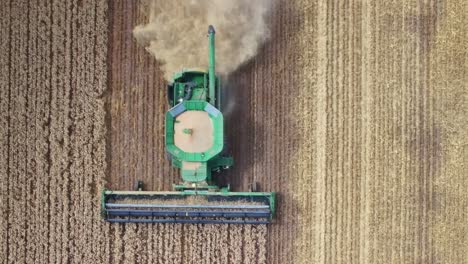 Overhead-of-a-combine-harvester-showing-harvesting-of-crop-and-dust-cloud-behind