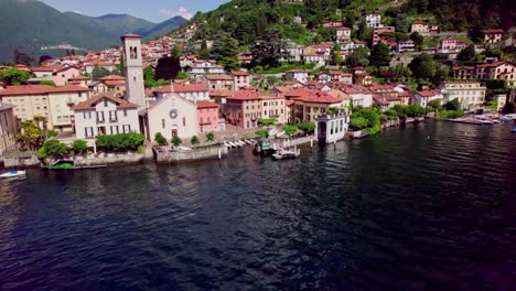The-colourful-village-of-Torno,-on-Lake-Como-aerial-reveal,-Italy