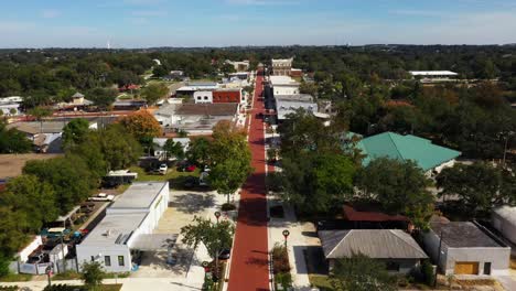 Drone-high-angle-aerial-overview-establish-historic-downtown-Clermont-Florida-at-midday