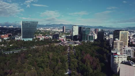 Dolly-panoramic-of-the-Petroleum-Fountain-at-the-intersection-of-Paseo-de-la-Reforma-Avenue-and-the-Periferico-on-a-beautiful-morning-in-Mexico-City
