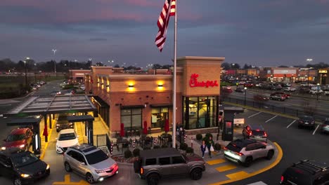 Chick-Fil-A-restaurant-with-American-flag-during-sunset