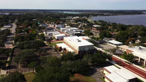 Drone-orbits-left-to-right-around-historic-main-street-in-downtown-Clermont-Florida