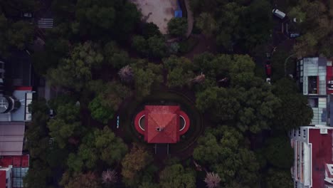 Bird's-eye-view-of-Lincoln-Park,-with-its-red-roofed-clock-tower,-ponds,-playgrounds-and-music-hall-nestled-among-several-trees