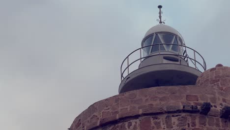 Capture-of-Faro-de-Camarinal,-time-tested-16th-century-lighthouse-constructed-on-a-beacon-tower-with-a-spiral-staircase-and-views