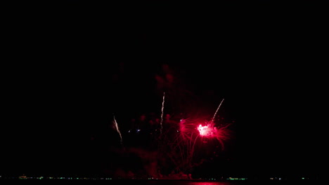 Closer-capture-of-the-climaxing-fireworks-at-sea-as-people-watch-from-the-beach,-Pattaya-international-Fireworks-Festival-2023,-Thailand