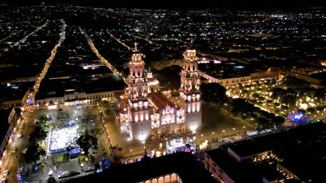 Morelia-Cathedral-in-the-historic-center,-Christmas-time-at-night-with-drone