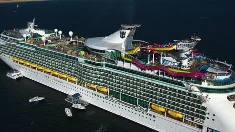 Aerial-view-tilting-over-the-Navigator-of-the-seas-cruiseliner,-in-sunny-Mexico