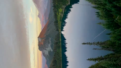 Vertical-video,-Mount-Rainier-and-the-Summit-lake-cinematic-shot-sunset,-Tahobet-is-a-large-active-stratovolcano-in-the-Cascade-Range,-located-in-Mount-Rainier-National-park
