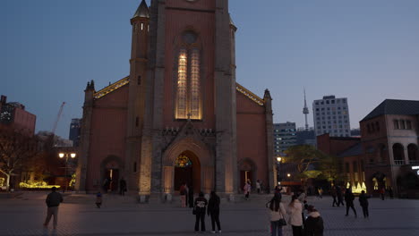People-Travel-Around-Myeongdong-Cathedral-at-Dusk-in-Seoul