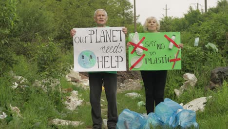 Senior-volunteers-with-protesting-posters-Our-Planet-Needs-Help,-Say-No-To-Plastic.-Nature-pollution