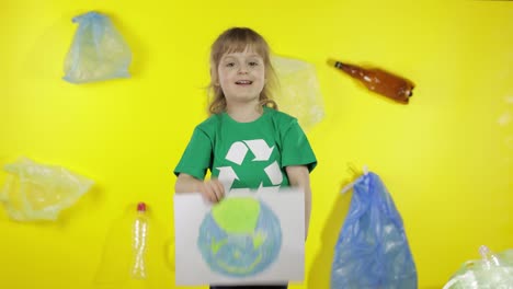 Girl-volunteer-holding-painted-picture-of-Earth.-Plastic-trash-nature-pollution.-Save-ecology