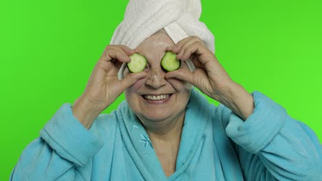 Elderly-grandmother-in-bathrobe-after-shower.-Old-woman-with-slices-of-cucumber