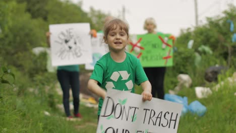 Girl-volunteer-holds-protesting-poster-Don't-Trash-Our-Future.-Plastic-nature-pollution.-Recycle