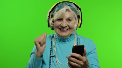 Elderly-grandmother.-Caucasian-woman.-Dance,-celebrate,-listen-music.-Chroma-key