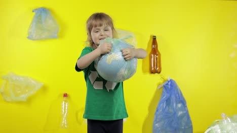 Girl-activist-tries-to-free-Earth-globe-from-plastic-package.-Reduce-trash-pollution.-Save-ecology