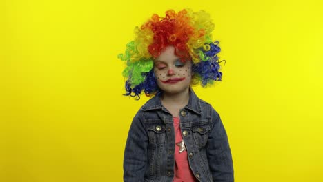 Little-child-girl-clown-in-colorful-wig.-Money-dollar-cash-banknotes-income-falls-from-above