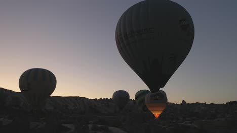 Aerial-view-turkey-in-Cappadocia-hot-air-ballon-Close-up-of-hot-air-balloon-where-tourists-are-sitting-in-the-balloon