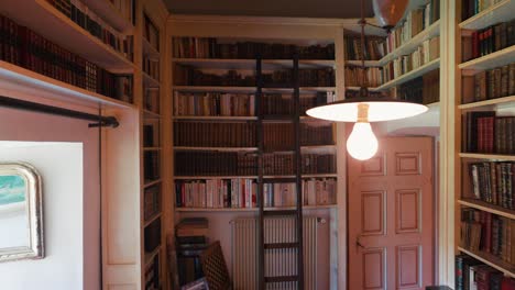 Scenic-library-room-with-shelves-full-of-books-in-french-castle