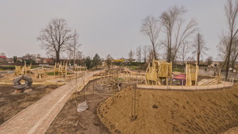 Time-lapse-of-landscaping-of-a-new-playground-and-park-during-changing-seasons