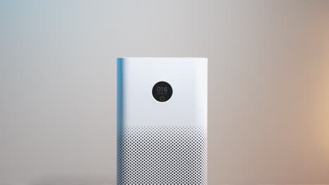 Close-up-of-an-air-purifier-with-a-display-showing-good-air-quality